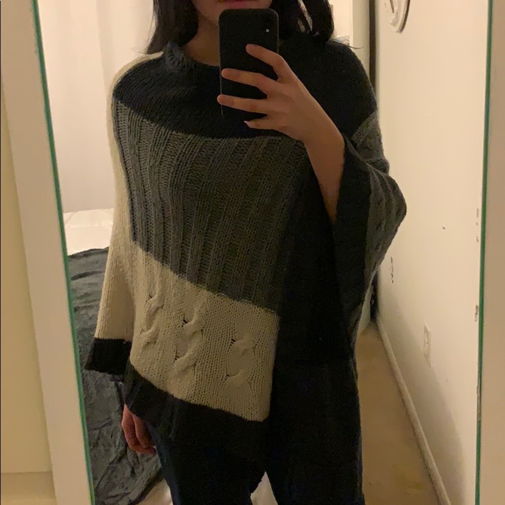 A grey white and black shawl